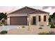 Charming one-story home showcasing a two-car garage, desert landscaping, and a welcoming entrance at 22810 N 182Nd Ln, Surprise, AZ 85387