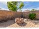 Backyard with a brick fire pit at 2424 E Peach Tree Dr, Chandler, AZ 85249