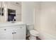 Bathroom features a white vanity, toilet, and a shower and tub combination at 2424 E Peach Tree Dr, Chandler, AZ 85249