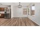 Bright dining area with a modern light fixture and views of the neighborhood at 2424 E Peach Tree Dr, Chandler, AZ 85249