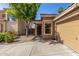 Welcoming single-story home with a tile roof and an attached two-car garage at 2424 E Peach Tree Dr, Chandler, AZ 85249