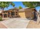 Attractive single-story home showcasing a tile roof and a spacious two-car garage at 2424 E Peach Tree Dr, Chandler, AZ 85249
