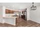 Open concept kitchen featuring stainless steel appliances and a breakfast bar at 2424 E Peach Tree Dr, Chandler, AZ 85249