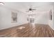 Bright living room featuring wood-look floors and sliding glass doors for easy access at 2424 E Peach Tree Dr, Chandler, AZ 85249