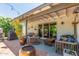Inviting backyard patio with comfortable seating and a fire pit, ideal for gatherings at 2444 S Noche De Paz --, Mesa, AZ 85202