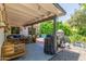 Spacious backyard patio with an outdoor grill and dining, perfect for entertaining at 2444 S Noche De Paz --, Mesa, AZ 85202