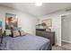 Bedroom with blue bed, dinosaur decorations, and a bright window at 2444 S Noche De Paz --, Mesa, AZ 85202