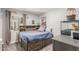 Cozy bedroom with blue bed, dinosaur decorations, and a bright window at 2444 S Noche De Paz --, Mesa, AZ 85202