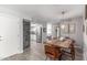 Bright dining room leading into a kitchen with a stainless-steel refrigerator and plenty of room at 2444 S Noche De Paz --, Mesa, AZ 85202