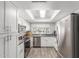 Bright kitchen featuring stainless steel appliances, white cabinetry, and stylish countertops at 2444 S Noche De Paz --, Mesa, AZ 85202