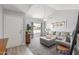 Bright living room features vaulted ceiling, large windows, and neutral color palette at 2444 S Noche De Paz --, Mesa, AZ 85202