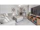 Cozy living room with comfortable seating, stylish decor, and access to other living spaces at 2444 S Noche De Paz --, Mesa, AZ 85202