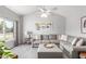Inviting living area with vaulted ceilings, ample natural light, and decorative art at 2444 S Noche De Paz --, Mesa, AZ 85202