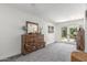 Main bedroom with carpet and access to the outdoor patio at 2444 S Noche De Paz --, Mesa, AZ 85202
