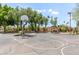 Outdoor basketball court surrounded by mature trees, offering a recreational space for residents at 2616 S El Dorado --, Mesa, AZ 85202