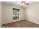 This bedroom features neutral walls, carpet, and a ceiling fan for a relaxing feel at 2616 S El Dorado --, Mesa, AZ 85202
