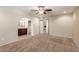 This open bedroom has neutral walls and carpet, as well as a view into the primary bath at 2616 S El Dorado --, Mesa, AZ 85202