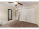 Bedroom with a ceiling fan, carpet flooring, closet, and a mirror at 2616 S El Dorado --, Mesa, AZ 85202