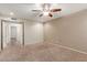 This bedroom features neutral walls and carpet and a view into an adjacent room at 2616 S El Dorado --, Mesa, AZ 85202