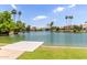 Picturesque community lake with private docks and boats, surrounded by beautiful homes and palm trees at 2616 S El Dorado --, Mesa, AZ 85202