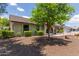 Well maintained front yard and facade with attractive desert landscaping and shade tree at 2616 S El Dorado --, Mesa, AZ 85202
