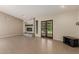 Spacious living room featuring a modern fireplace, tile floors, and access to the backyard at 2616 S El Dorado --, Mesa, AZ 85202