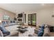 Spacious living room with fireplace, stylish decor, and access to outdoor space at 2616 S El Dorado --, Mesa, AZ 85202