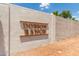 Close-up of the community's entrance sign; 'Dobson Ranch' in raised gold lettering against a textured wall at 2616 S El Dorado --, Mesa, AZ 85202