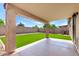 Backyard featuring covered patio, artificial turf and block wall fence at 30212 N Sunray Dr, San Tan Valley, AZ 85143