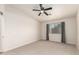 Well-lit bedroom featuring neutral walls, neutral carpet, and a ceiling fan at 30212 N Sunray Dr, San Tan Valley, AZ 85143
