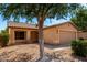 Inviting single-story home with desert landscaping, two-car garage, and covered porch at 30212 N Sunray Dr, San Tan Valley, AZ 85143