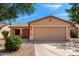 Charming single-story home featuring a two-car garage and low-maintenance desert landscaping at 30212 N Sunray Dr, San Tan Valley, AZ 85143