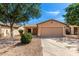 Charming single-story home featuring a two-car garage and low-maintenance desert landscaping at 30212 N Sunray Dr, San Tan Valley, AZ 85143