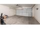 Spacious two car garage featuring large white door at 30212 N Sunray Dr, San Tan Valley, AZ 85143