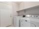 Laundry room features both washer and dryer units at 30212 N Sunray Dr, San Tan Valley, AZ 85143
