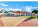 Residential backyard featuring a basketball court, playground and patio at 322 E Gary Cir, Mesa, AZ 85201