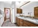 Bathroom with double sink vanity, granite countertops and step-in shower at 322 E Gary Cir, Mesa, AZ 85201