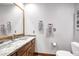 Bathroom features a white basin, granite countertops, and neutral accents at 322 E Gary Cir, Mesa, AZ 85201