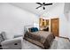 Cozy bedroom features a comfortable bed, desk and natural light from the window at 322 E Gary Cir, Mesa, AZ 85201