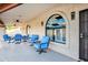 Covered patio offers an inviting space with comfortable seating and views of the backyard at 322 E Gary Cir, Mesa, AZ 85201
