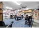 Basement game room with pool table, comfortable seating, and sports decor at 322 E Gary Cir, Mesa, AZ 85201