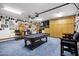 Game room with pool table, bar-style seating, and ample lighting at 322 E Gary Cir, Mesa, AZ 85201