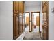 Hallway view reveals beautiful wood cabinets and access to multiple bedrooms at 322 E Gary Cir, Mesa, AZ 85201
