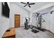 Bright home gym featuring modern exercise equipment, wood floors and natural light at 322 E Gary Cir, Mesa, AZ 85201