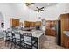 Open kitchen featuring a long kitchen island with bar stool seating at 322 E Gary Cir, Mesa, AZ 85201