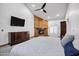Main bedroom features a fireplace, vaulted ceiling, and lots of natural light at 322 E Gary Cir, Mesa, AZ 85201