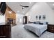 Spacious main bedroom boasts a fireplace, vaulted ceiling, and a walk-in closet at 322 E Gary Cir, Mesa, AZ 85201