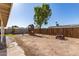 Large backyard featuring play structure and pink side-by-side with plenty of room to play at 3256 W Libby St, Phoenix, AZ 85053