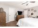 Neutral bedroom with ceiling fan and a light filled vanity area at 3256 W Libby St, Phoenix, AZ 85053