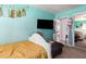 Cozy bedroom with blue walls, a dark accent bed, and carpet at 3256 W Libby St, Phoenix, AZ 85053